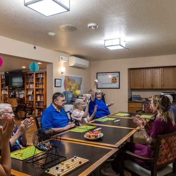 evenings porch dining room activity Residents gathered at the dining tables at Evenings Porch